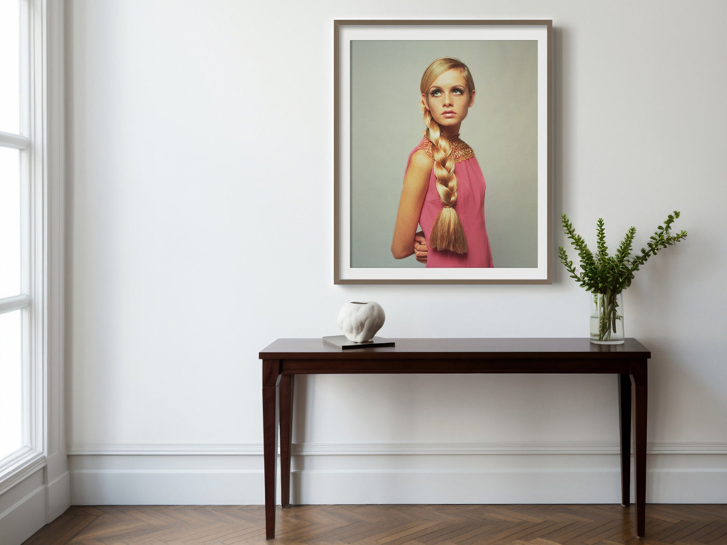 Twiggy In Pink Print Poster, Model Twiggy wearing a fashionable pink dress and a large plait in her long hair, 1966